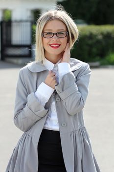 Beautiful young woman in sunglasses. Outdoor portrait