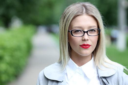 Beautiful young woman in sunglasses. Outdoor portrait