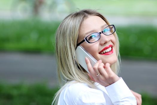 portrait of young woman talking on mobile phone