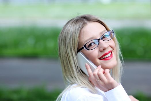 portrait of young woman talking on mobile phone
