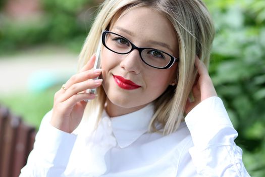portrait of young woman talking on mobile phone