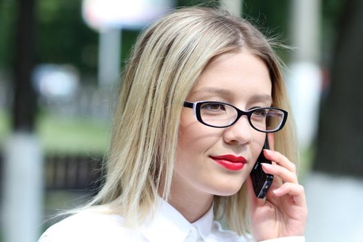 portrait of young woman talking on mobile phone