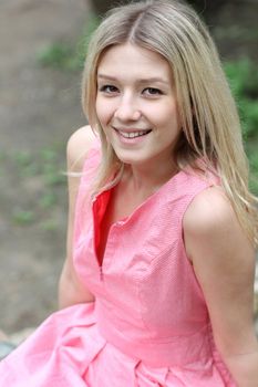 Beautiful young girl in pink dress