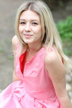 Beautiful young girl in pink dress