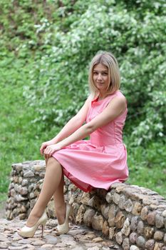 Beautiful young girl in pink dress