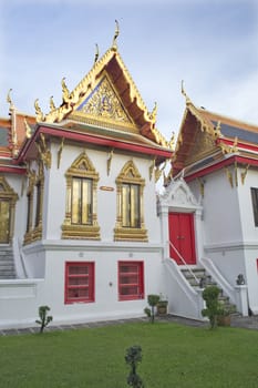 An ornate Thai temple with blue skies