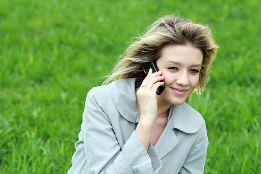 portrait of young woman talking on mobile phone