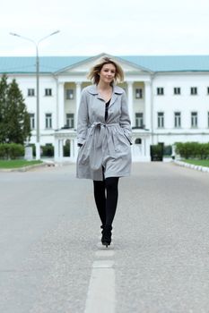beautiful young woman walking on the street