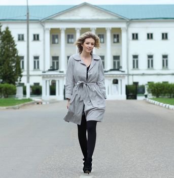 beautiful young woman walking on the street