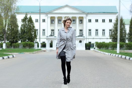 beautiful young woman walking on the street