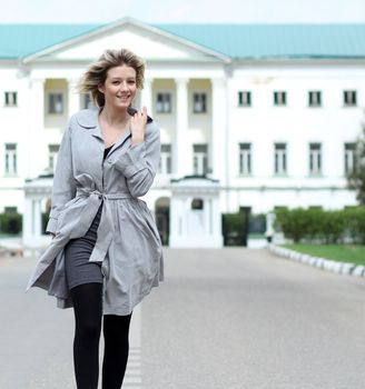 beautiful young woman walking on the street