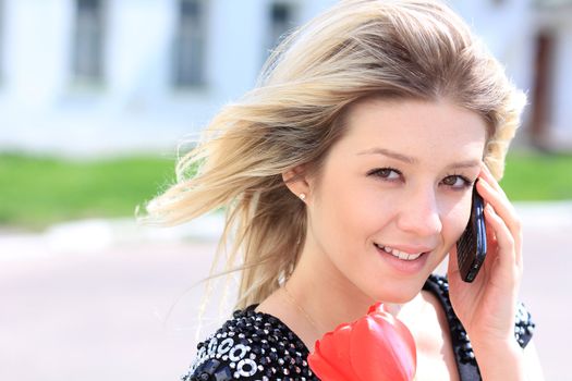 portrait of young woman talking on mobile phone