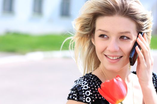 portrait of young woman talking on mobile phone