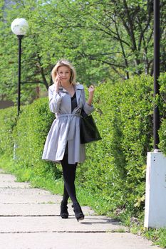 Happy young lady talking on mobile phone