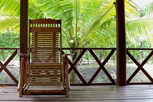 wooden chairs on a patio in the garden