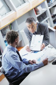 Business colleagues discussing together in an office