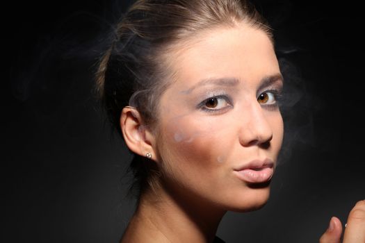 portrait of a girl in tobacco smoke