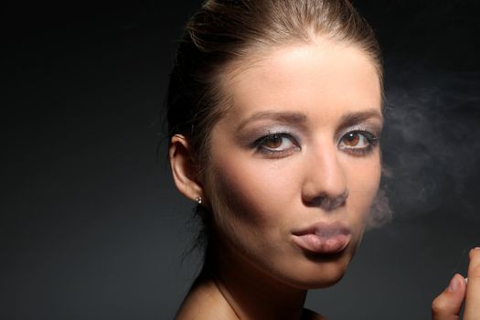 portrait of a girl in tobacco smoke