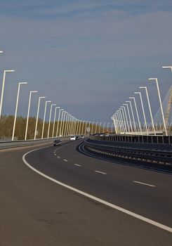 Highway over a bridge with little traffic