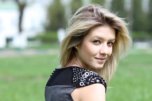 Beautiful young girl smiling. Outdoor portrait