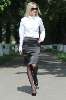 young business woman walking on the street