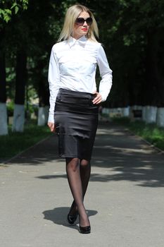young business woman walking on the street