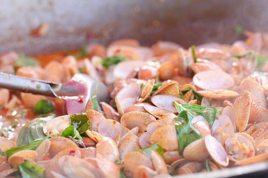 Spicy fried Shellfish fried in a pan