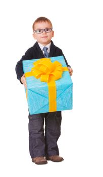 Small boy in spectacles with big present on white background