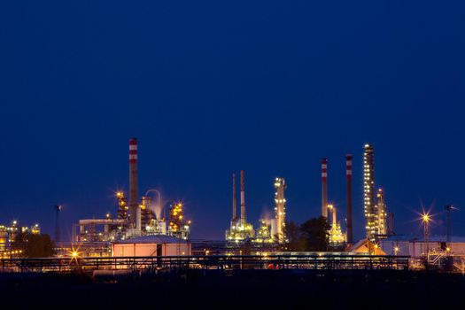 Oil refinery buildings at night