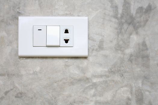 Light switch on the wall cement