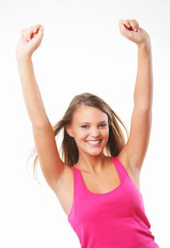 Beautiful happy young woman with her arms in the air. Isolated on white.
