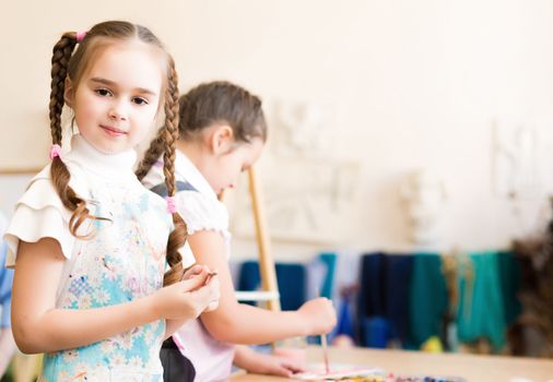 portrait of a girl in an apron, the kids involved in art school