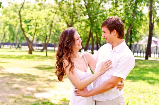 couple hugging in the park, have a good time together