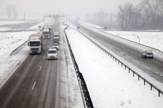 Highway traffic in heavy snowfall