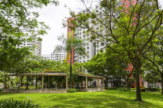 A new colorful neighborhood estate behind a domestic garden in Singapore