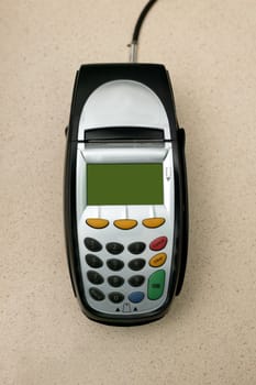 A eftpos machine on a plain background