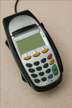 A eftpos machine on a plain background