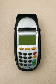 A eftpos machine on a plain background