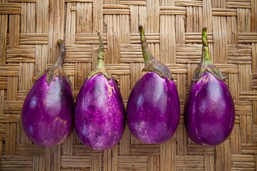 purple eggplant on bamboo craft  use for multipurpose