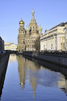 day view over water channel to the famous orthodox Church of Our Savior on Spilled Blood, called Spas-na-Krovi on Russian in St.Petersburg