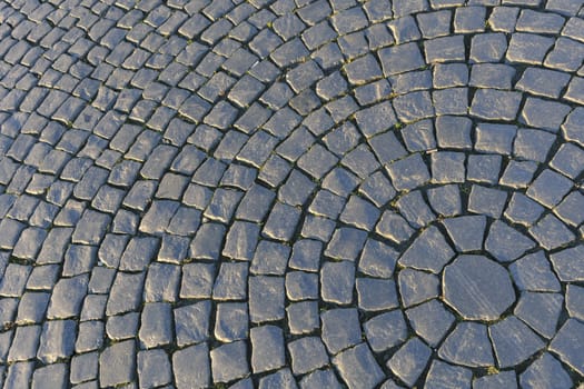 Circular detailed patterns of cobblestone make up Palace Square in St. Petersburg