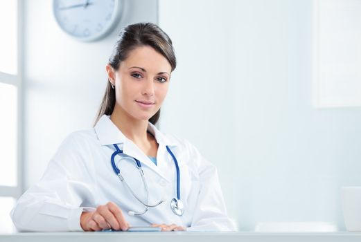 Portrait of a confident woman doctor sitting in her office