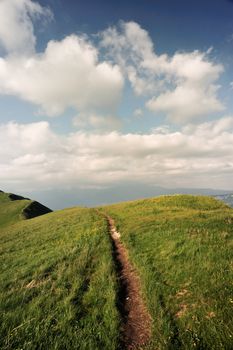 a path winds along the crest of the mountain