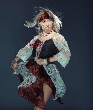 Female flamenco dancer on a studio background