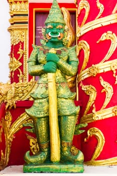 Giant guarding statue at Temple Thailand, Ancient decorative door of Thai temple