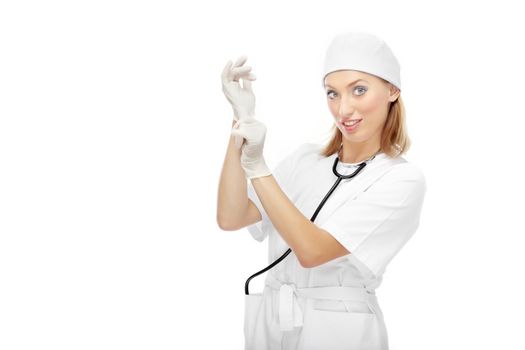 Pretty female doctor putting on the latex gloves