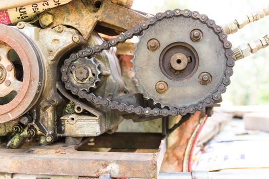 Old and rusty cogwheels with chain