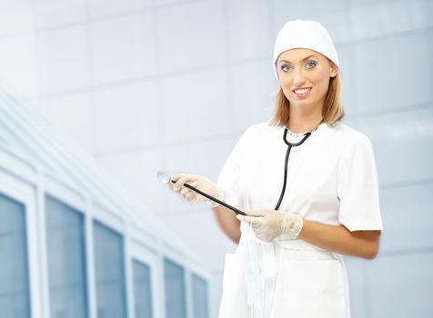 Smiling doctor indoors in uniform 