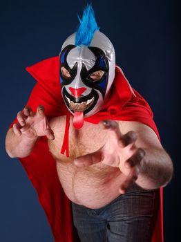 Photograph of a Mexican wrestler or Luchador posing.
