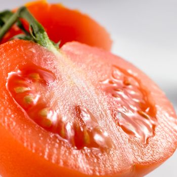 close-up of a tomato isolated on a white background